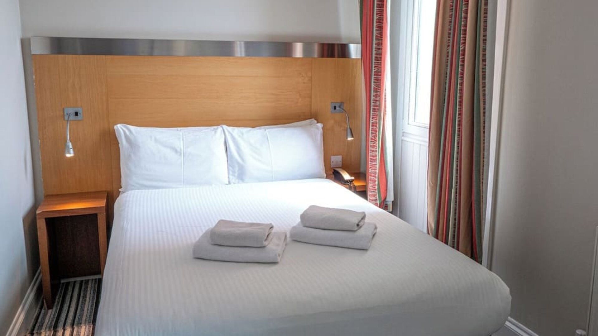 King bed at Belgrave Oval London Hotel.