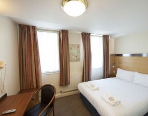 Day use room with work desk at Belgrave Oval London Hotel.