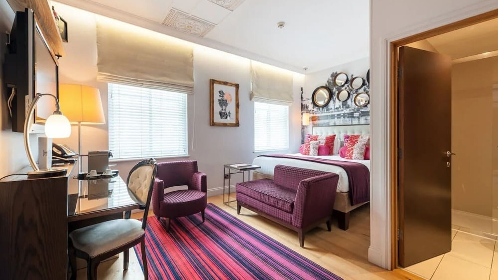 Day use room with work desk and lounge seating at Indigo London-Paddington Hotel.