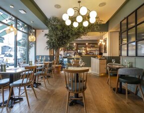 Dining area at Indigo London-Paddington Hotel.