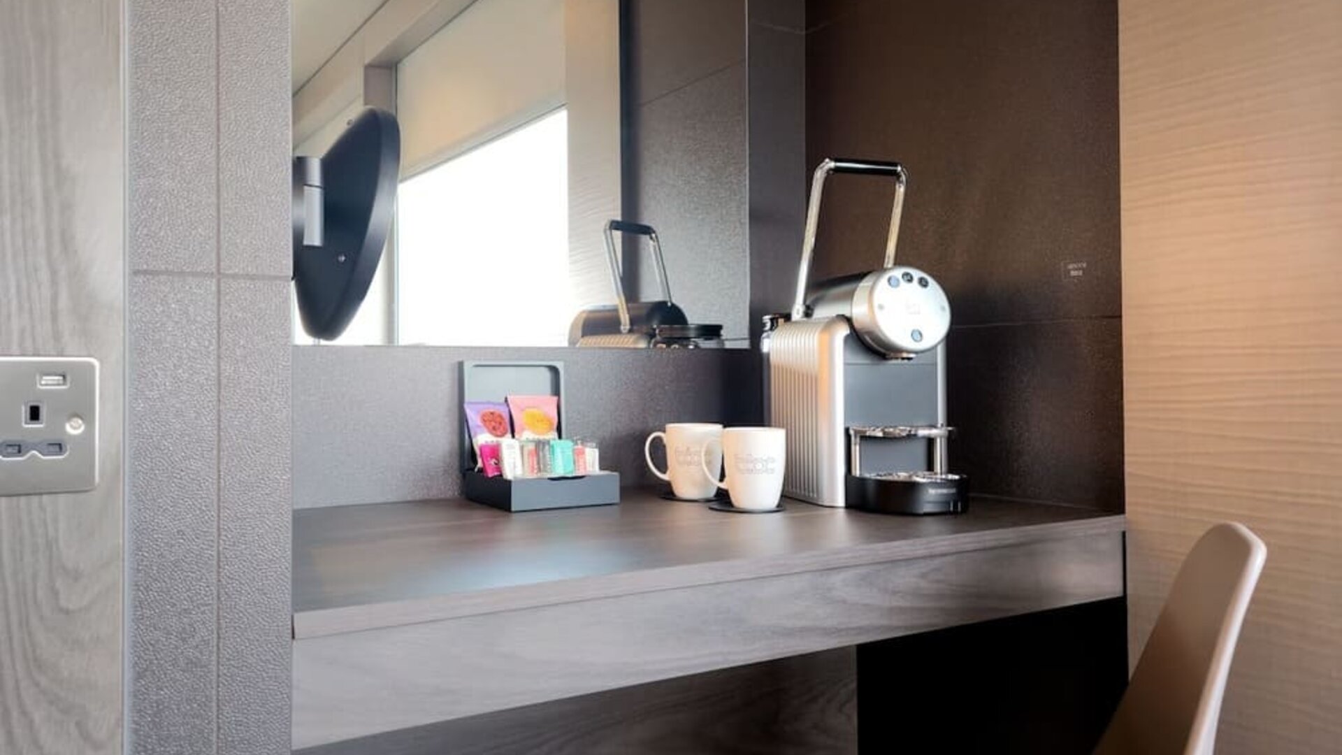 Room work desk with coffee and tea machine at BLOC Gatwick Hotel.