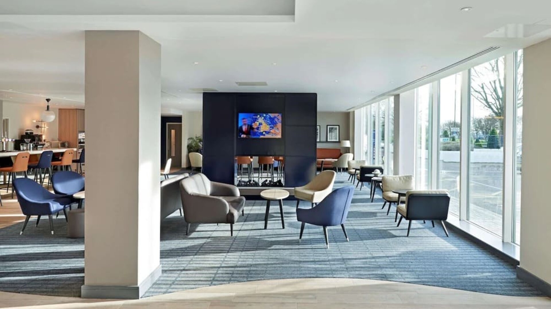 Bright and comfortable lobby lounge at Hyatt Place London Heathrow Airport.