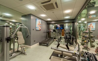 Fully equipped fitness center at Mercure Nottingham City Centre Hotel.