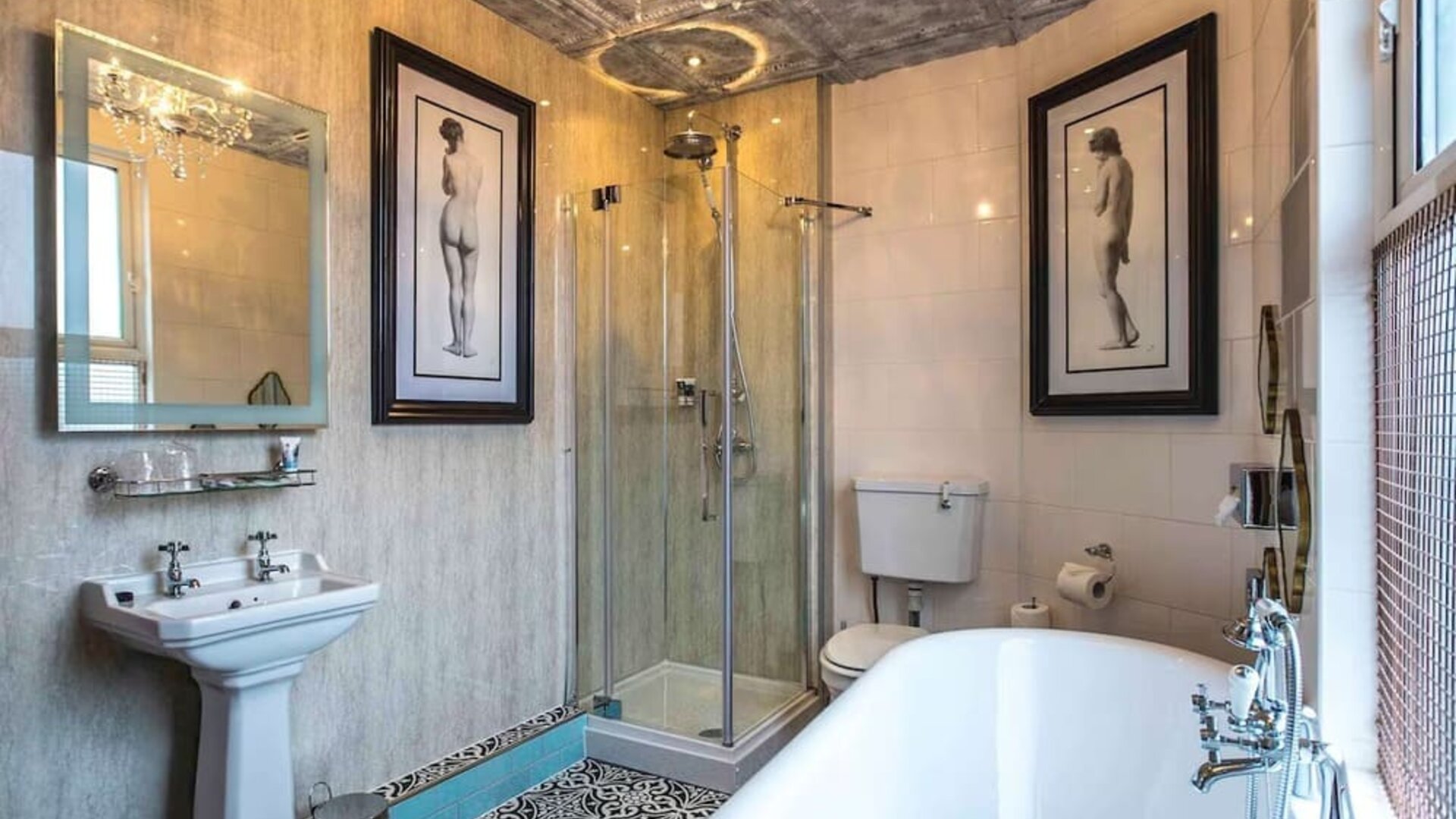 Private guest bathroom with tub, shower and free toiletries at Mercure Nottingham City Centre Hotel.