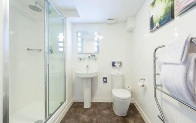 Guest bathroom with shower at Mercure Nottingham City Centre Hotel.