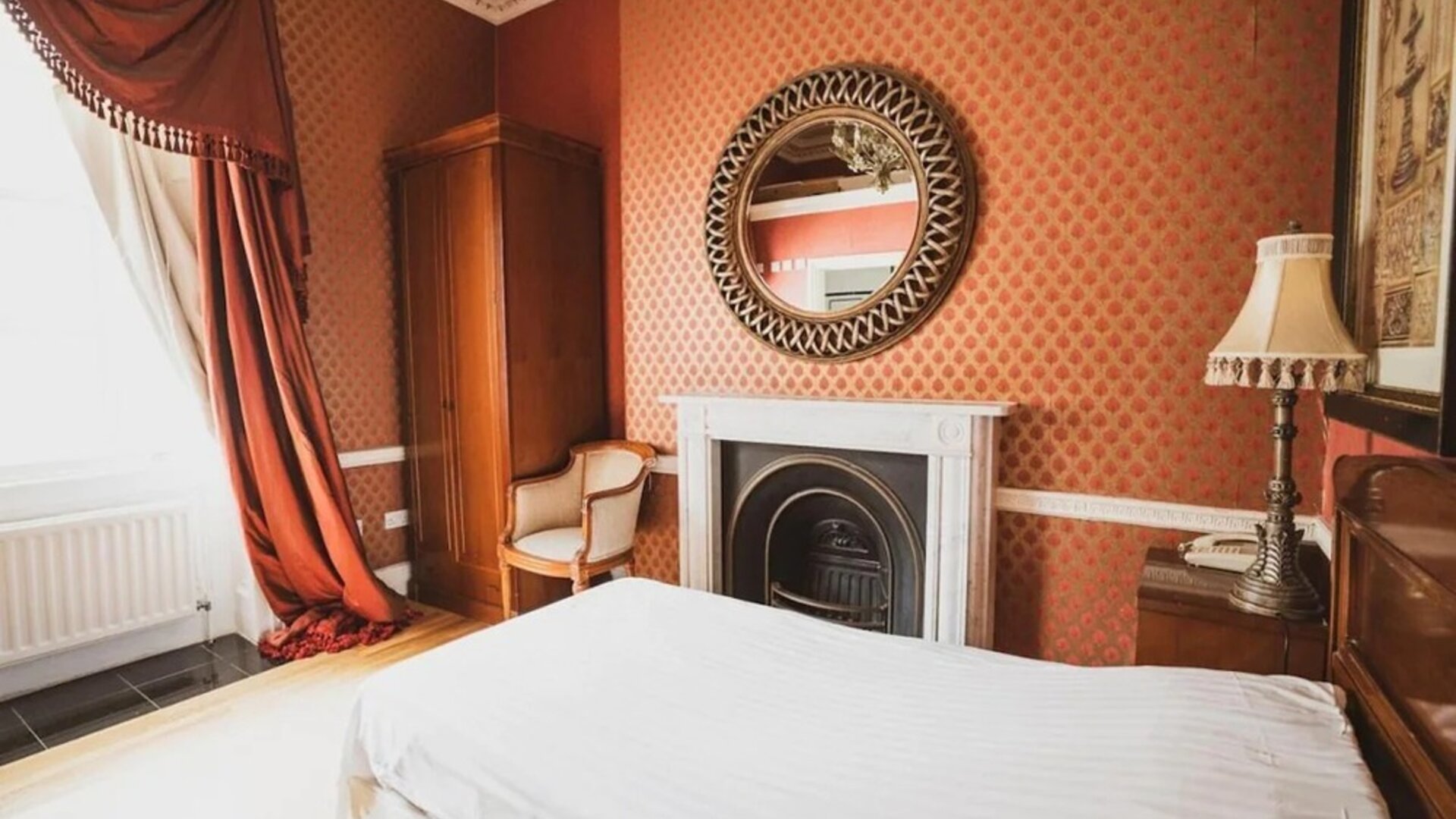 Bright and spacious day use room with fireplace at Opulence Central London Hotel.