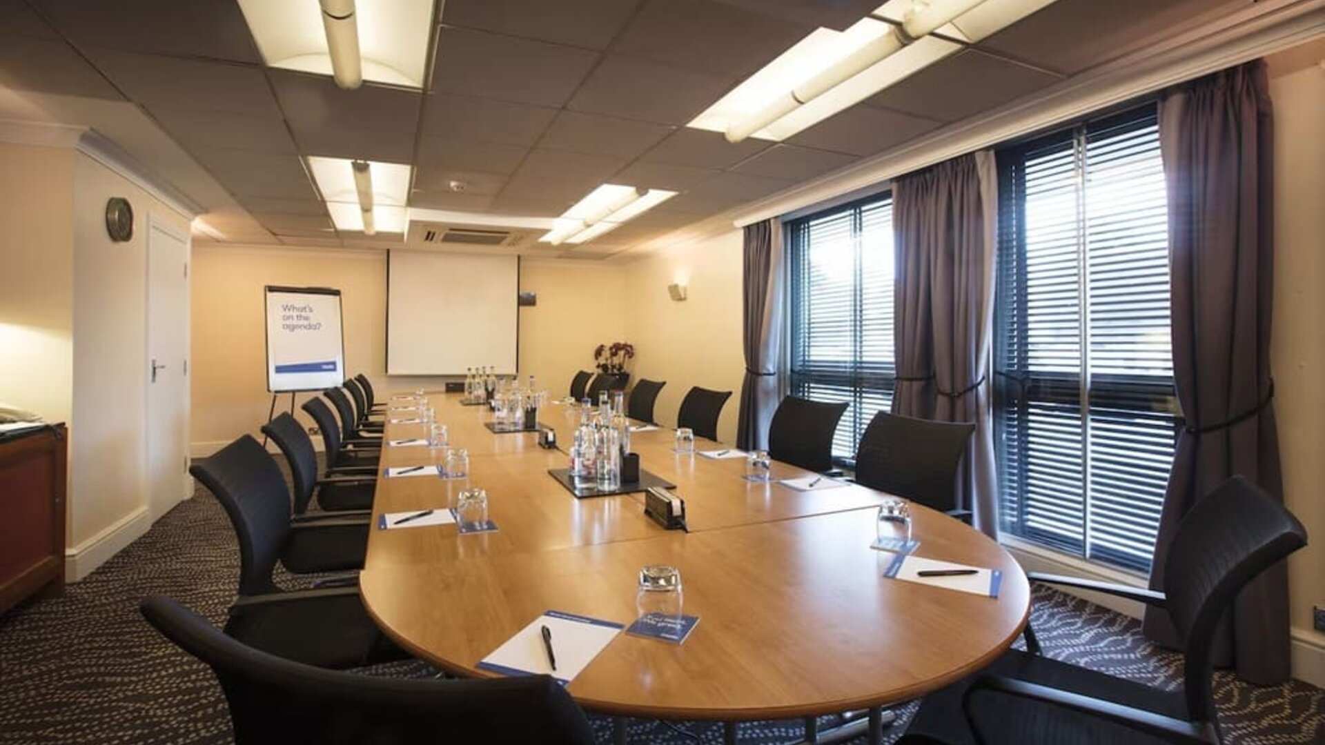 Professional meeting room with ergonomic chairs at Thistle London Heathrow Terminal 5 Hotel.