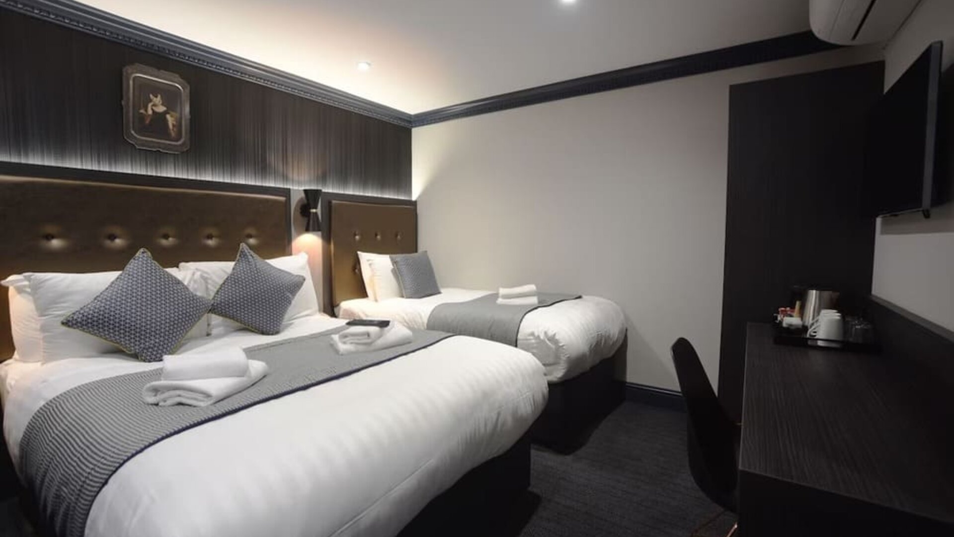 Day use triple room with work desk at The House Of Toby Hotel.