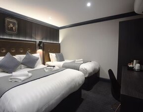 Day use triple room with work desk at The House Of Toby Hotel.