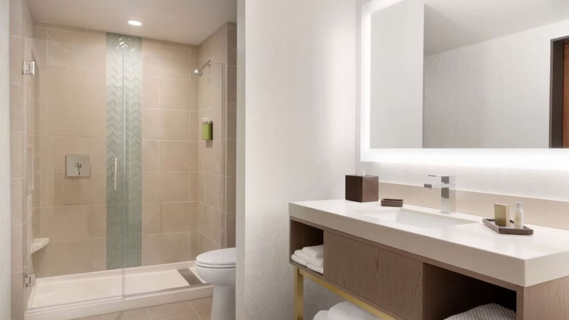 Guest bathroom with shower at Embassy Suites Boulder.

