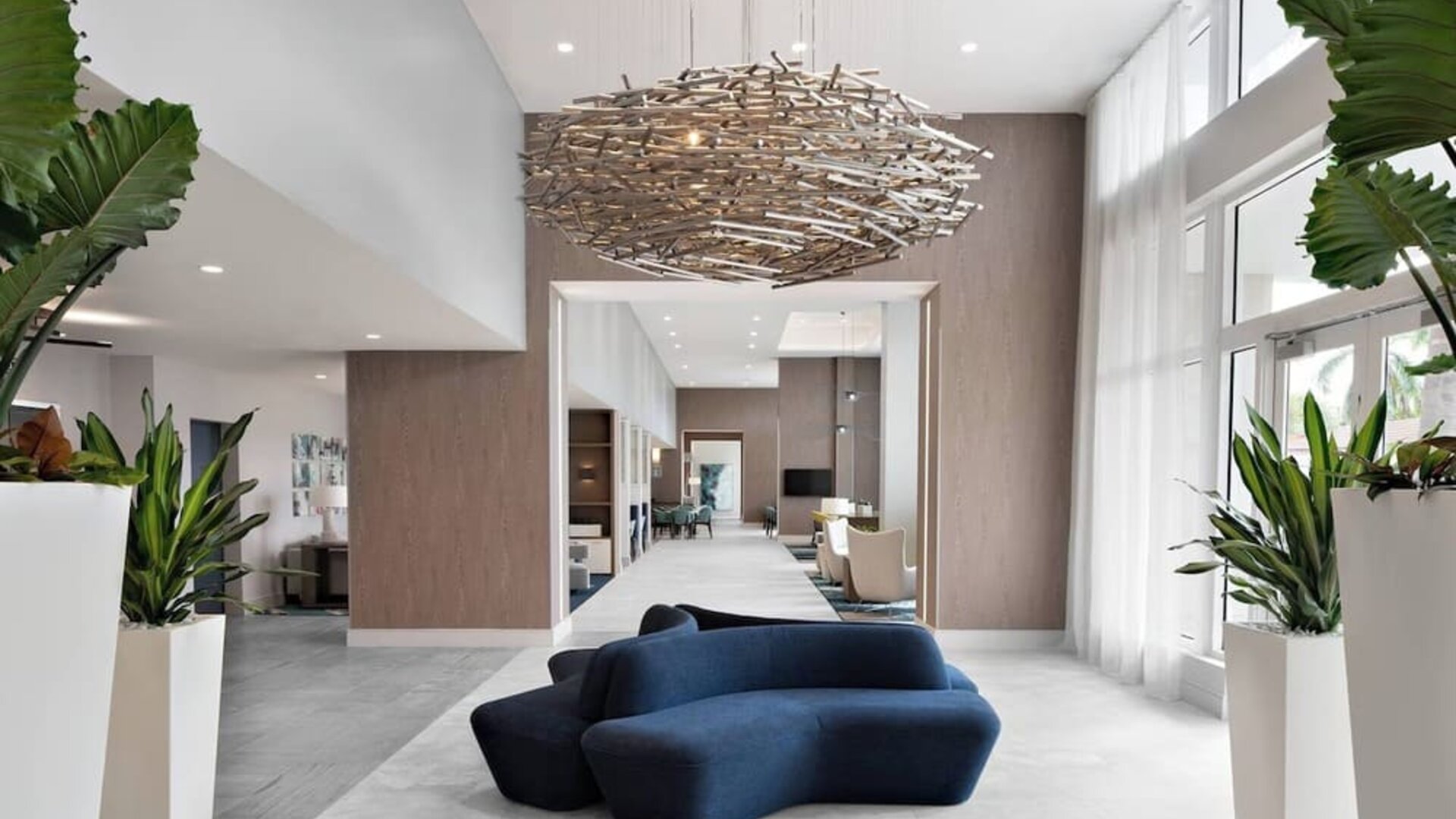 Lobby and coworking lounge at Courtyard Delray Beach.
