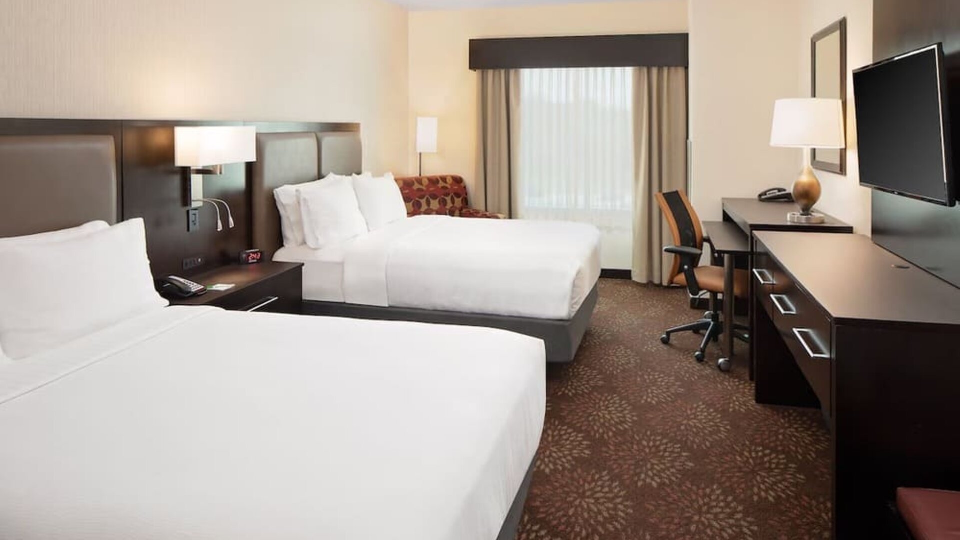 Two queen beds with work desk at Holiday Inn - Trophy Club.