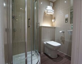Guest bathroom with shower at Chiswick Rooms.