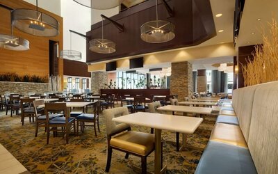 Dining area perfect for coworking at Embassy Suites By Hilton Denver Downtown Convention Center.