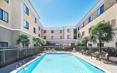 Refreshing outdoor pool at Courtyard Bossier City.