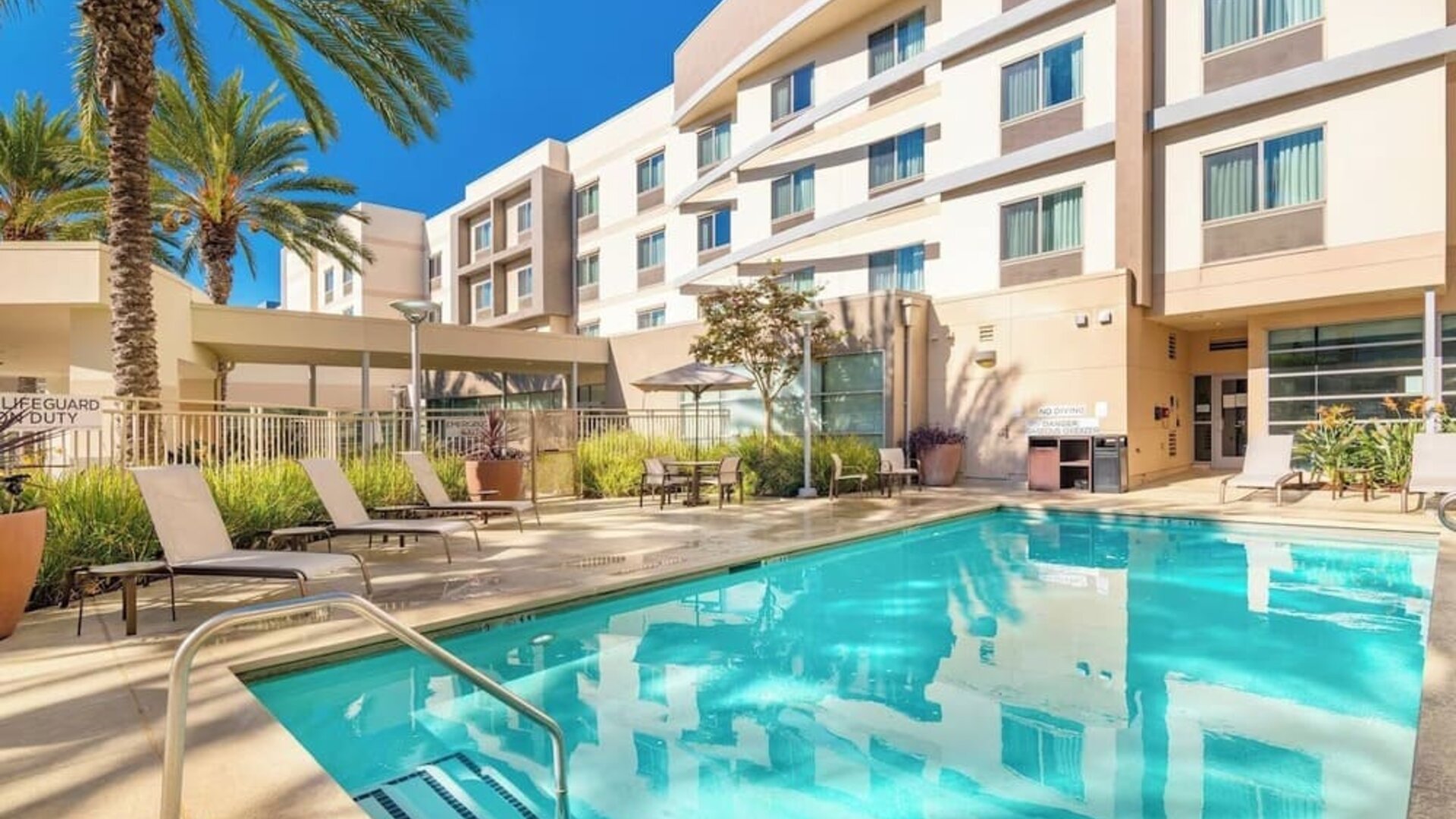 Refreshing outdoor pool at Courtyard By Marriott Santa Ana Orange County.