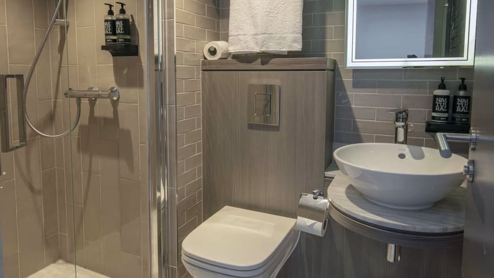 Private bathroom with shower and free toiletries at Best Western Plus Vauxhall Hotel.