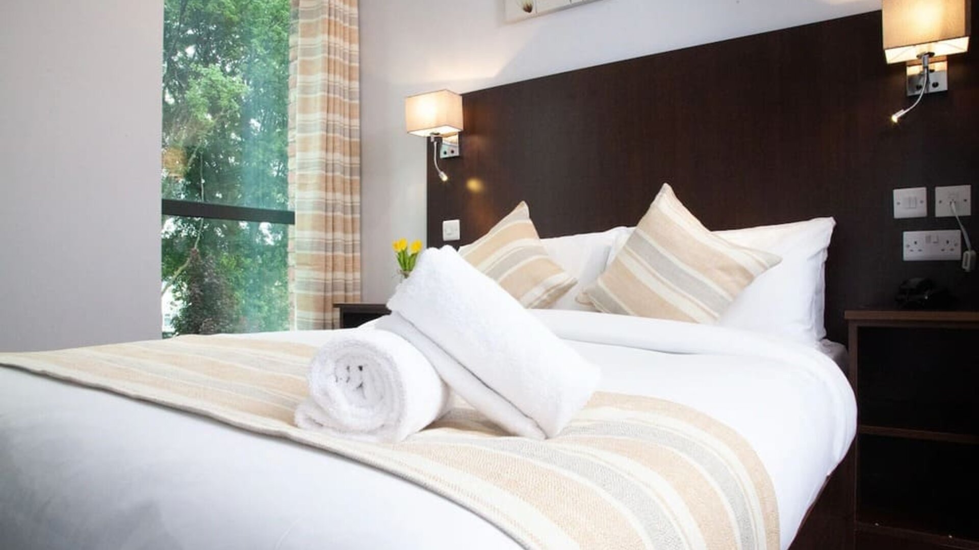 King bed at London City Airport Hotel.