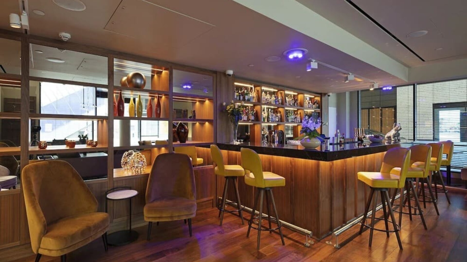 Hotel bar and lounge area at Tower Suites Hotel by Blue Orchid.