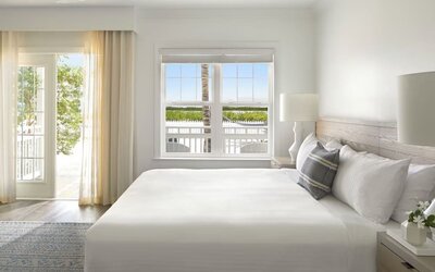 Romantic king room with natural light at Parrot Key Hotel & Villas.