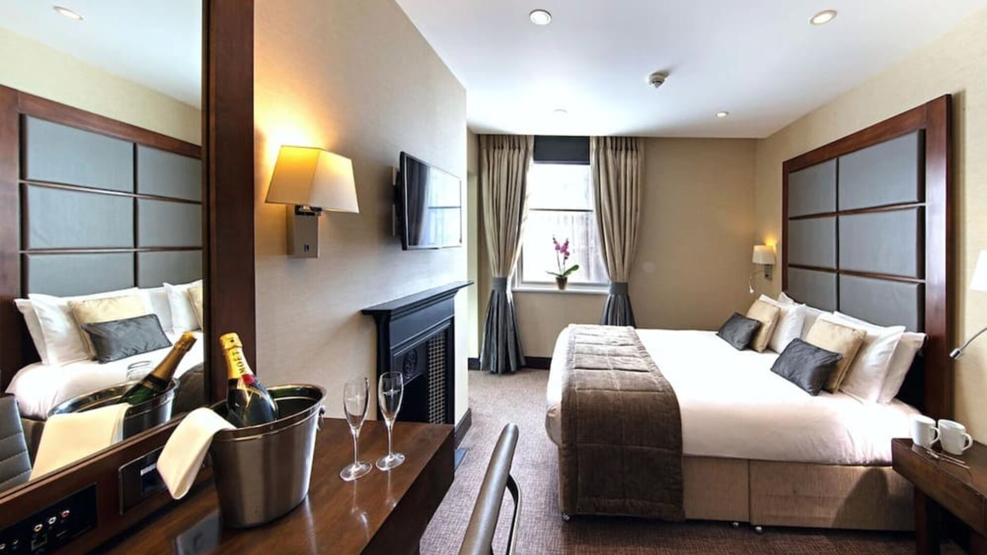 Day use queen room with work desk and fireplace at The Wellington by Blue Orchid Hotel (FKA The Rochester).