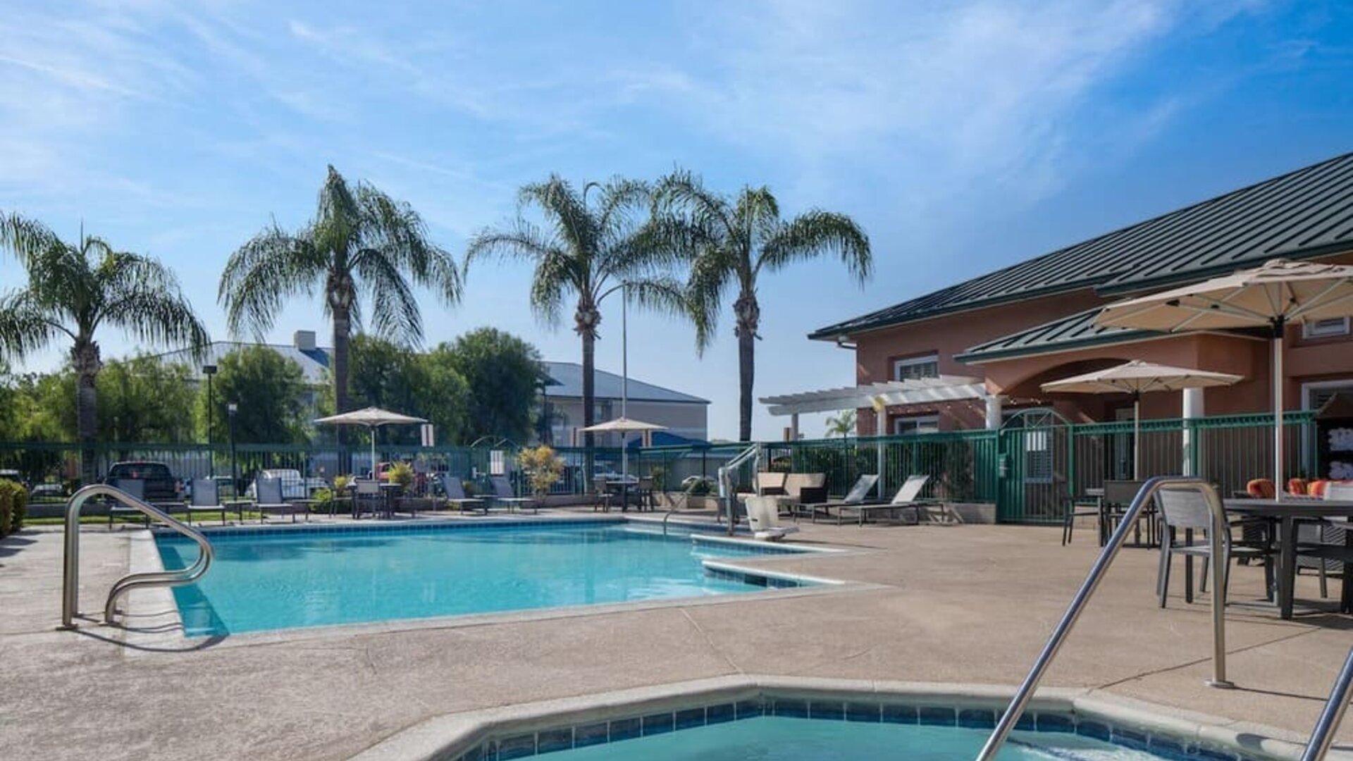 Refreshing outdoor pool and spa tub at Residence Inn Santa Clarita.