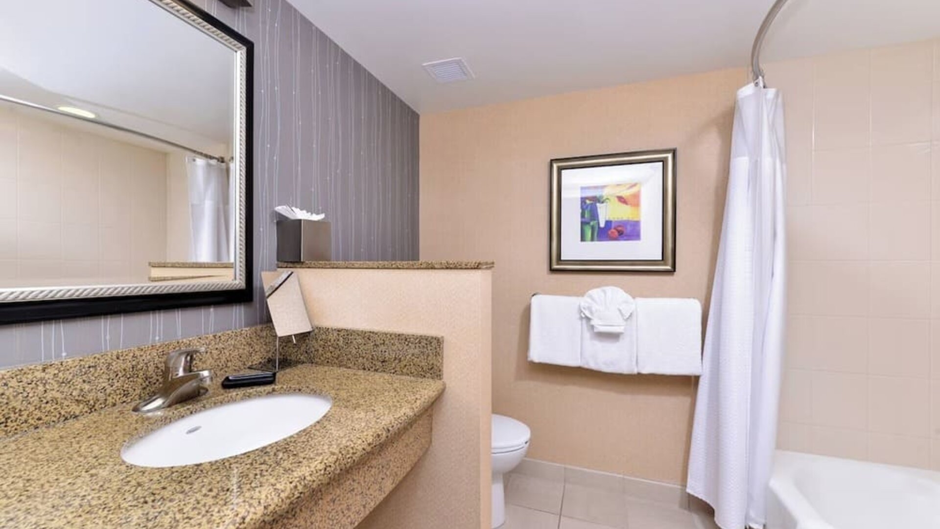 Guest bathroom with shower and tub at Courtyard By Marriott Boise West/Meridian.