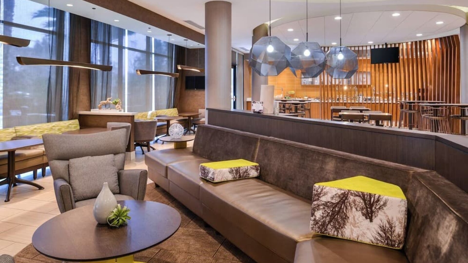 Lobby and coworking lounge at SpringHill Suites By Marriott Irvine John Wayne Airport/Orange County.