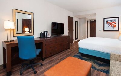 Day use room with work desk and sofa at Hilton Garden Inn Burbank Downtown.
