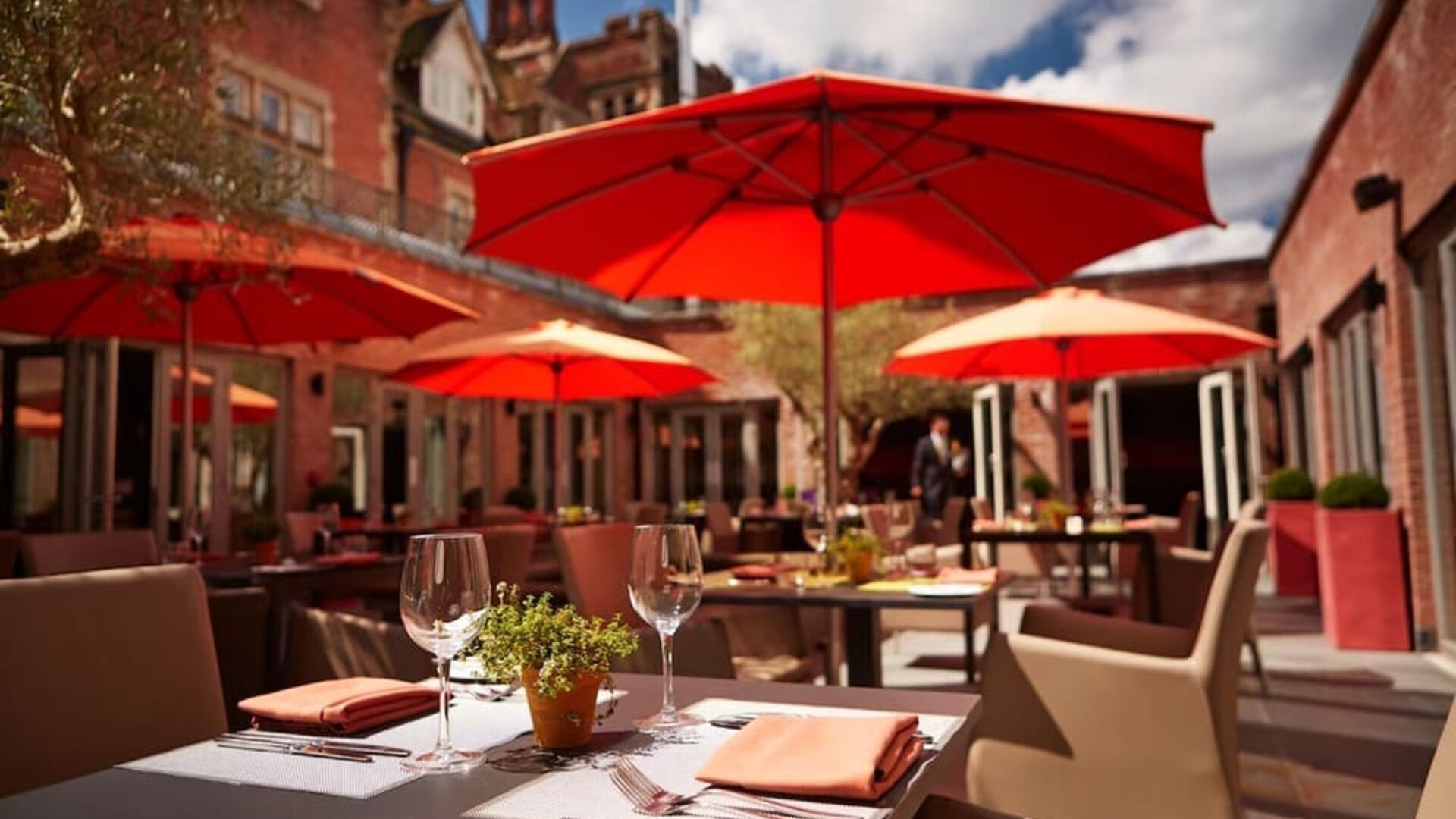 Hotel restaurant with outdoor seating at Alexander House Hotel And Utopia Spa Hotel.