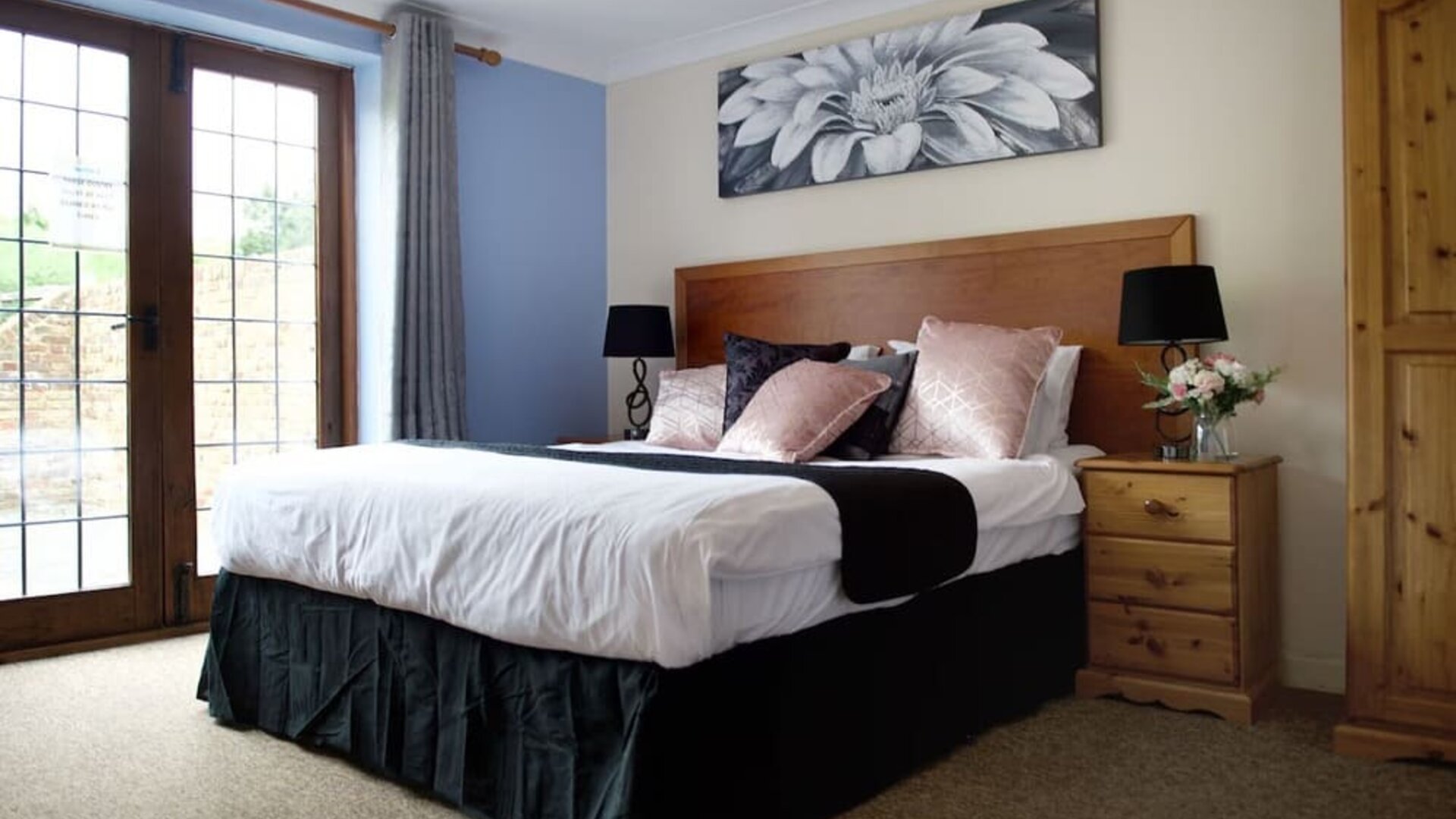 King bed at Little Foxes Hotel.