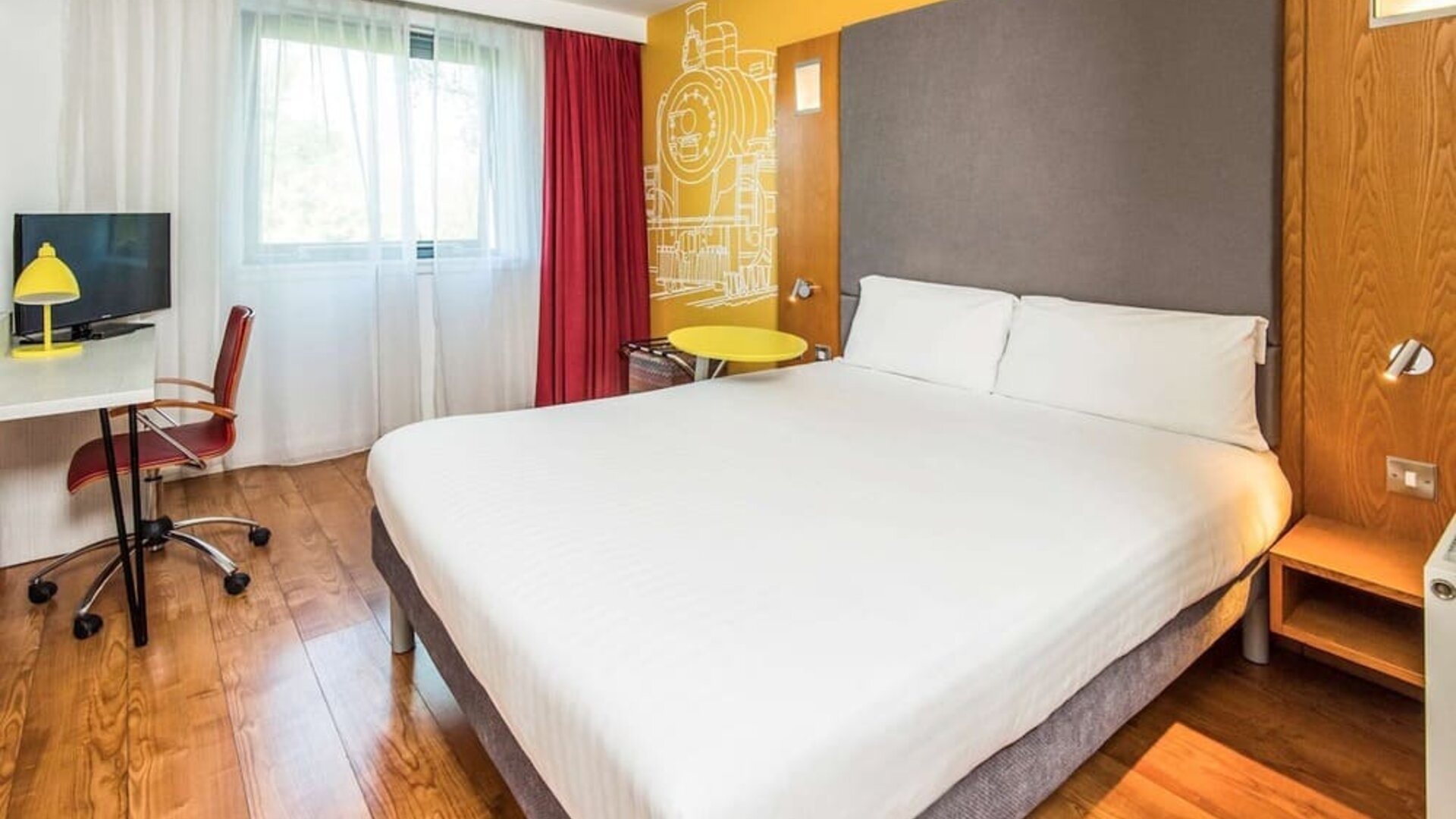 Bright and spacious day use room with king bed and work desk at Ibis Styles Crewe.