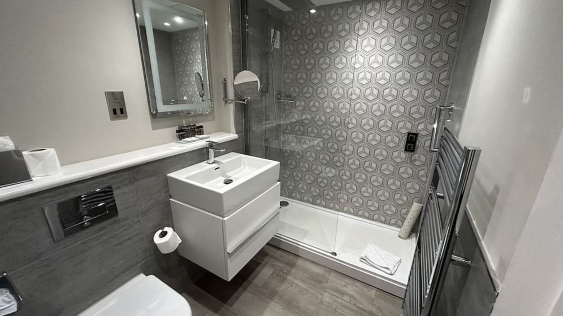Private guest bathroom with shower and free toiletries at Best Western Plus Dover Marina Hotel & Spa. 