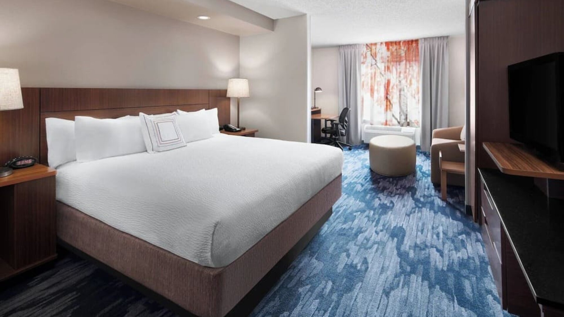 Day use room with work desk and sofa at Fairfield Inn By Marriott Denver Airport.