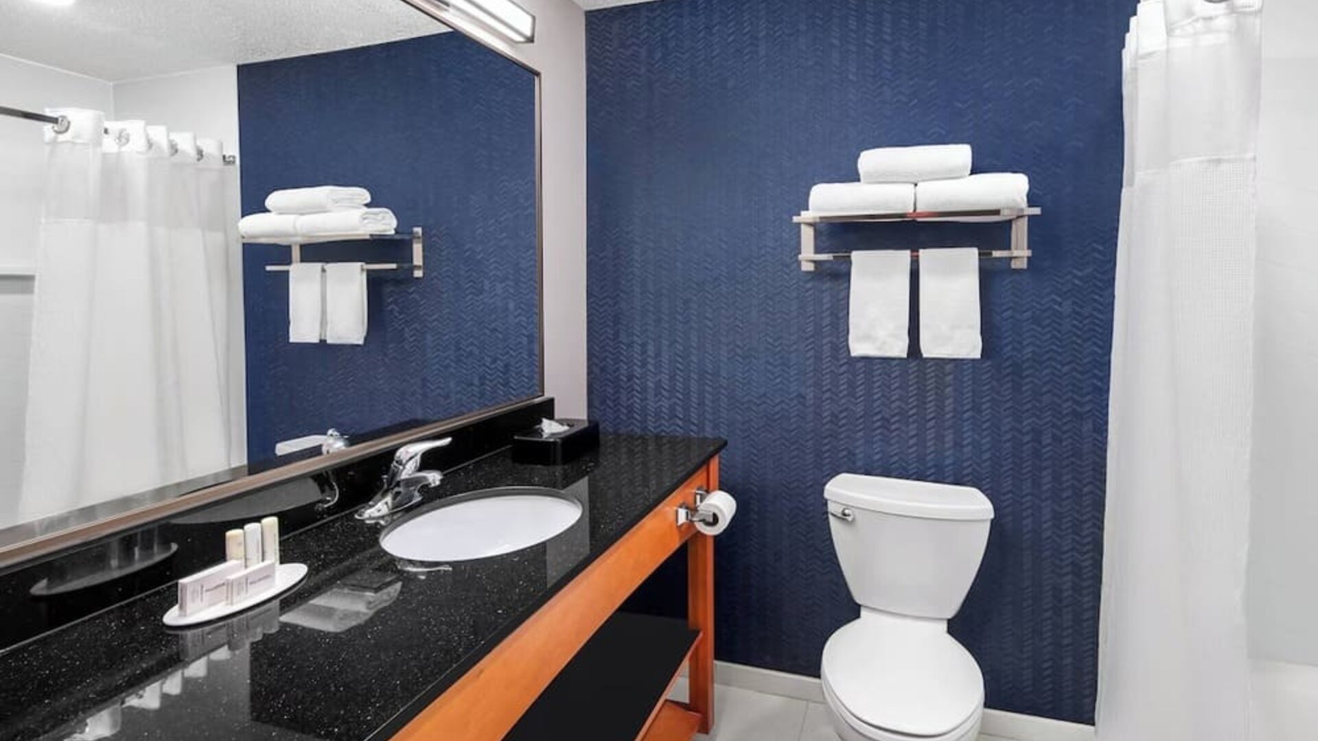 Guest bathroom with shower at Fairfield Inn By Marriott Denver Airport.