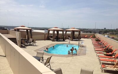 Refreshing outdoor pool in rooftop of Hyatt Regency Dallas.