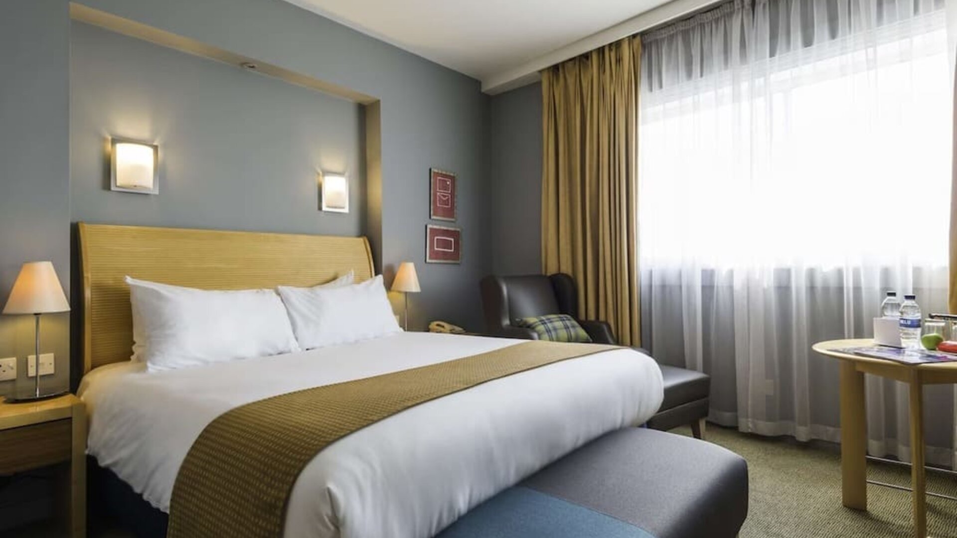 Day use room with workspace and lounge seating at Best Western London Heathrow Ariel Hotel.
