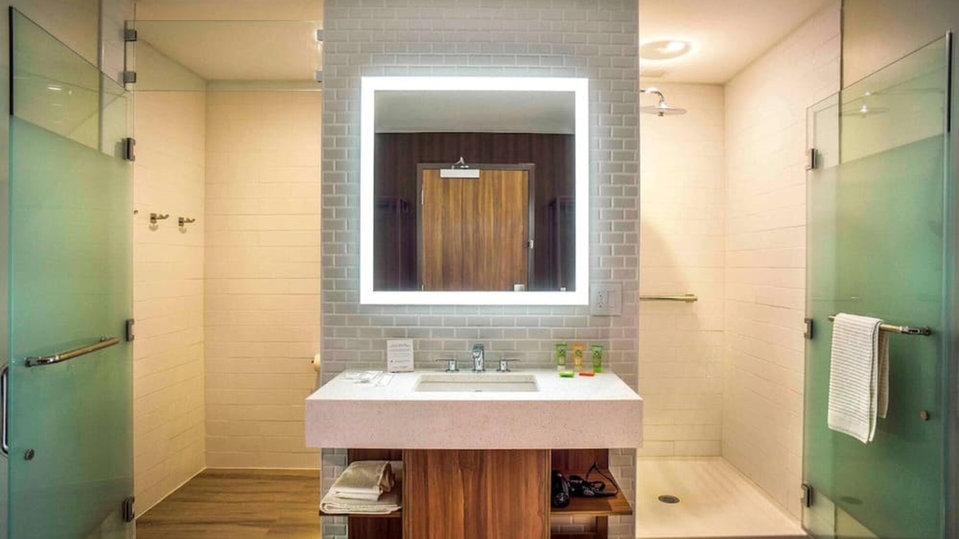 Guest bathroom with shower and free toiletries at Wyndham Garden North Bergen Near Secaucus.