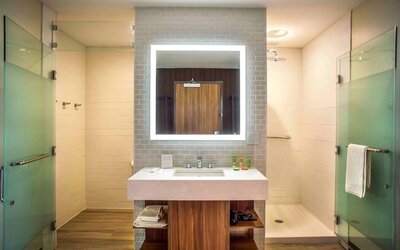 Guest bathroom with shower and free toiletries at Wyndham Garden North Bergen Near Secaucus.