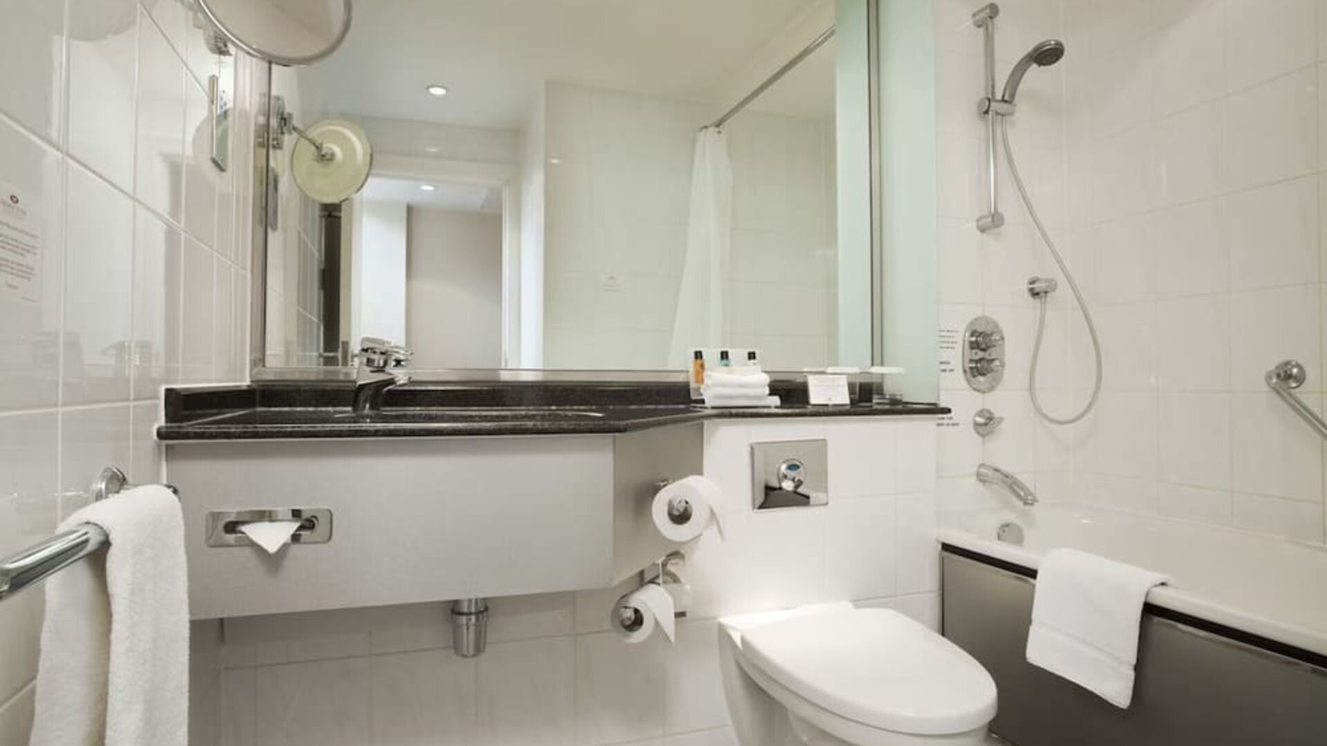 Private guest bathroom with shower at Crowne Plaza London - Heathrow.
