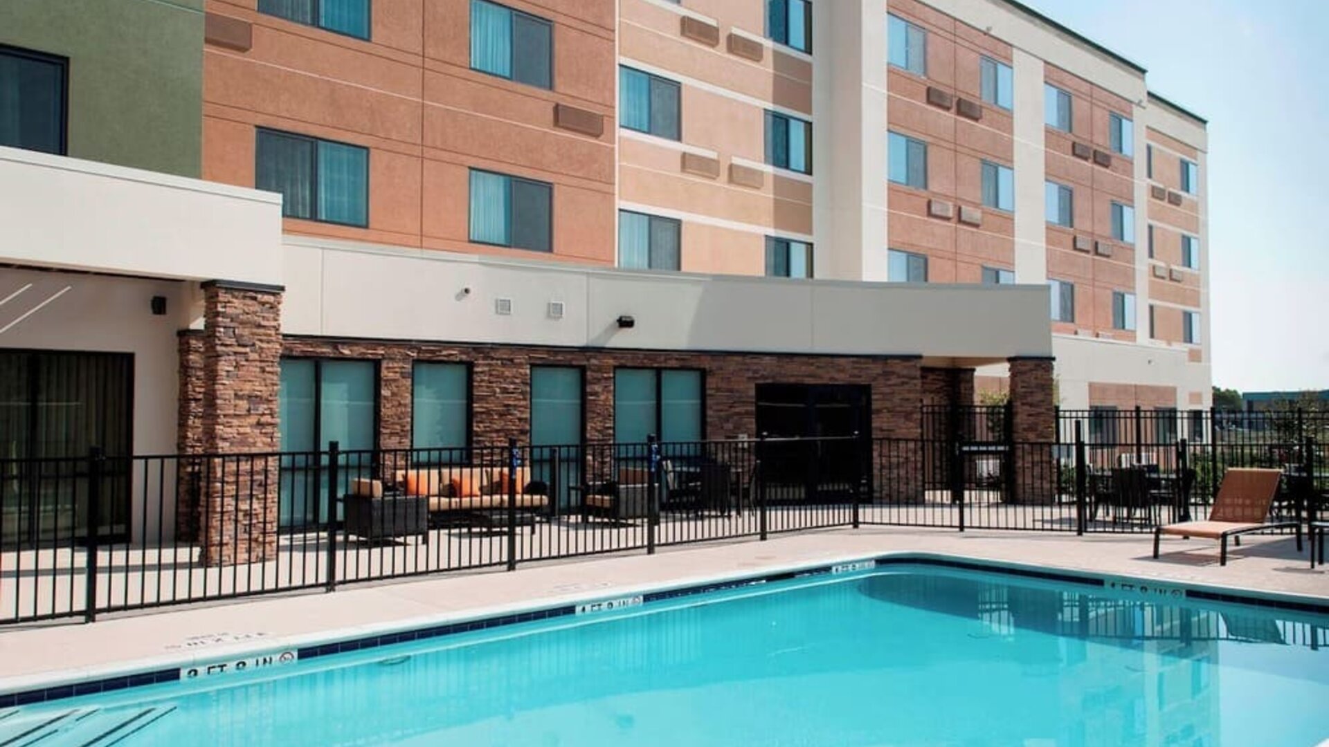 Refreshing outdoor pool at Courtyard By Marriott Houston NASA/Clear Lake.