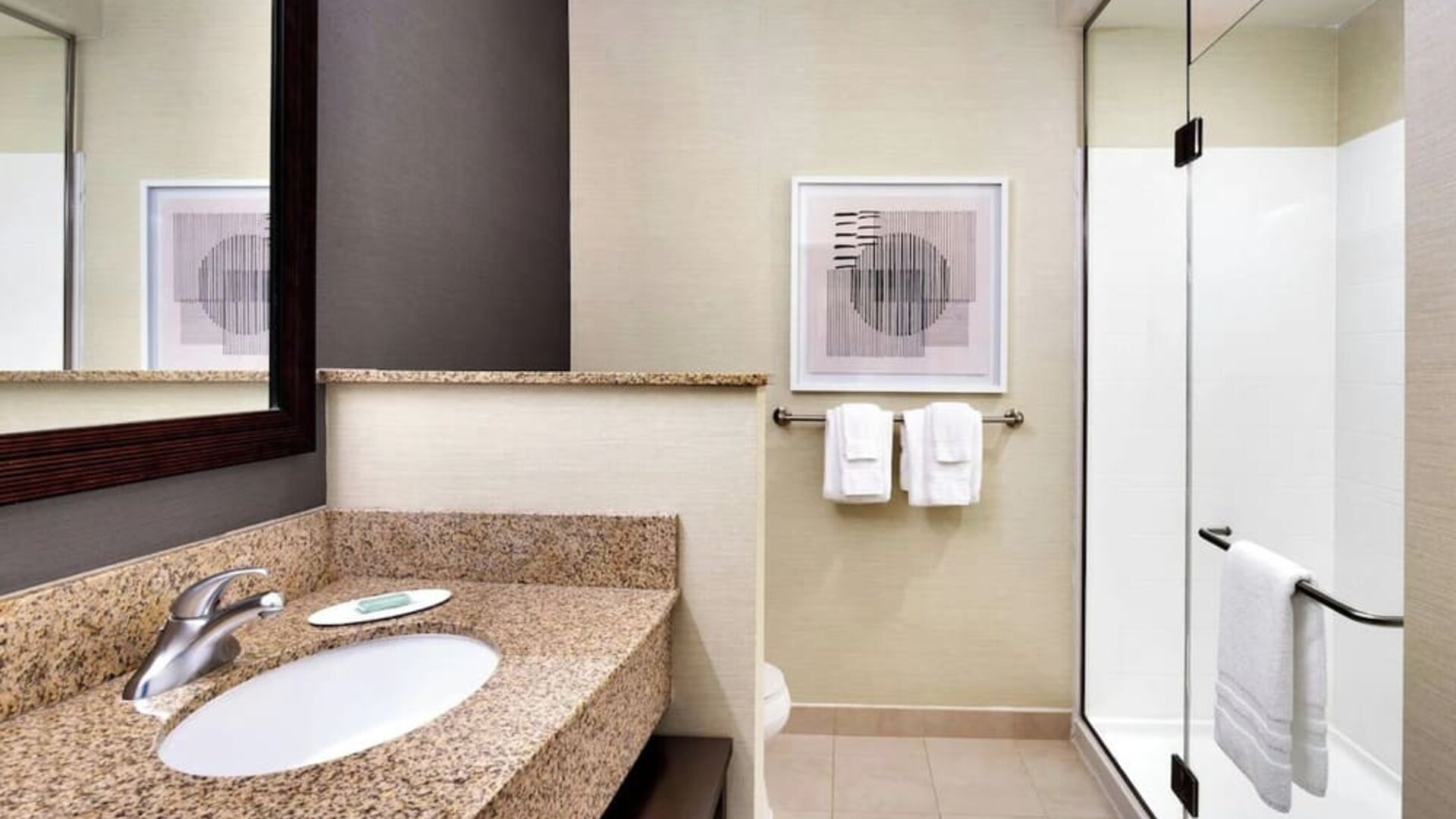 Guest bathroom with shower at Courtyard By Marriott Houston NASA/Clear Lake.