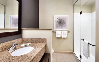 Guest bathroom with shower at Courtyard By Marriott Houston NASA/Clear Lake.