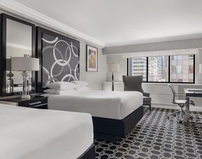 Queen beds at The Muse New York.