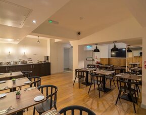 Dining area at Pelican London Residence & Hotel.