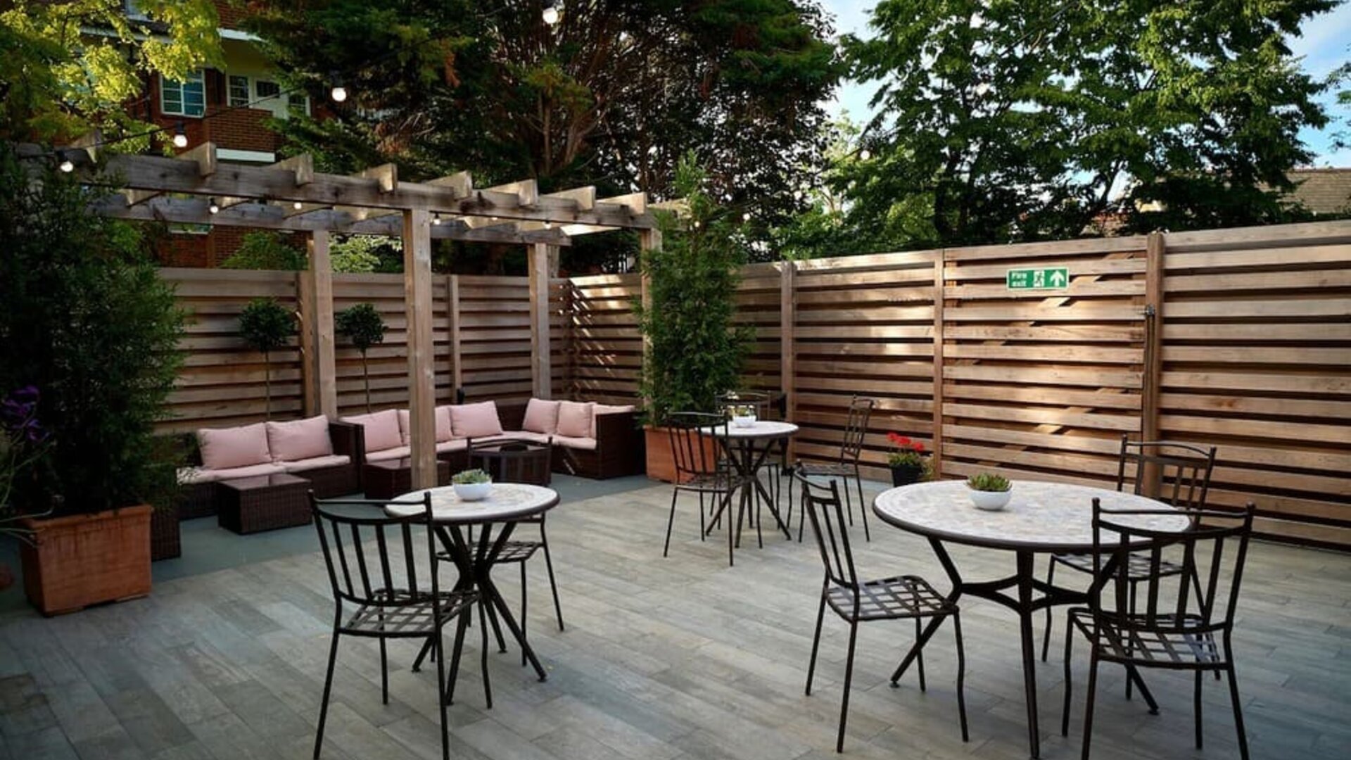 Terrace with seating area, perfect for coworking at The Lodge - Putney Hotel.