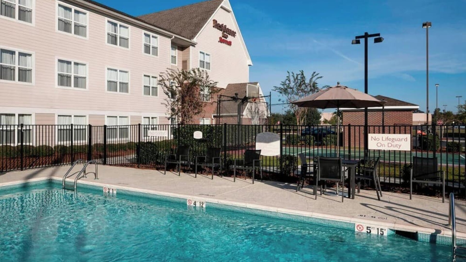 Refreshing outdoor pool at Residence Inn By Marriott Hattiesburg.
