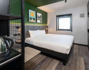 Day use room with king bed at Ibis London Gatwick Airport Hotel.