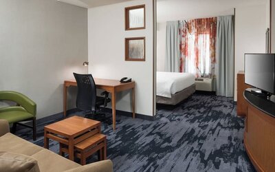 Day use room with living area and work desk at Fairfield Inn & Suites Kansas City Overland Park.