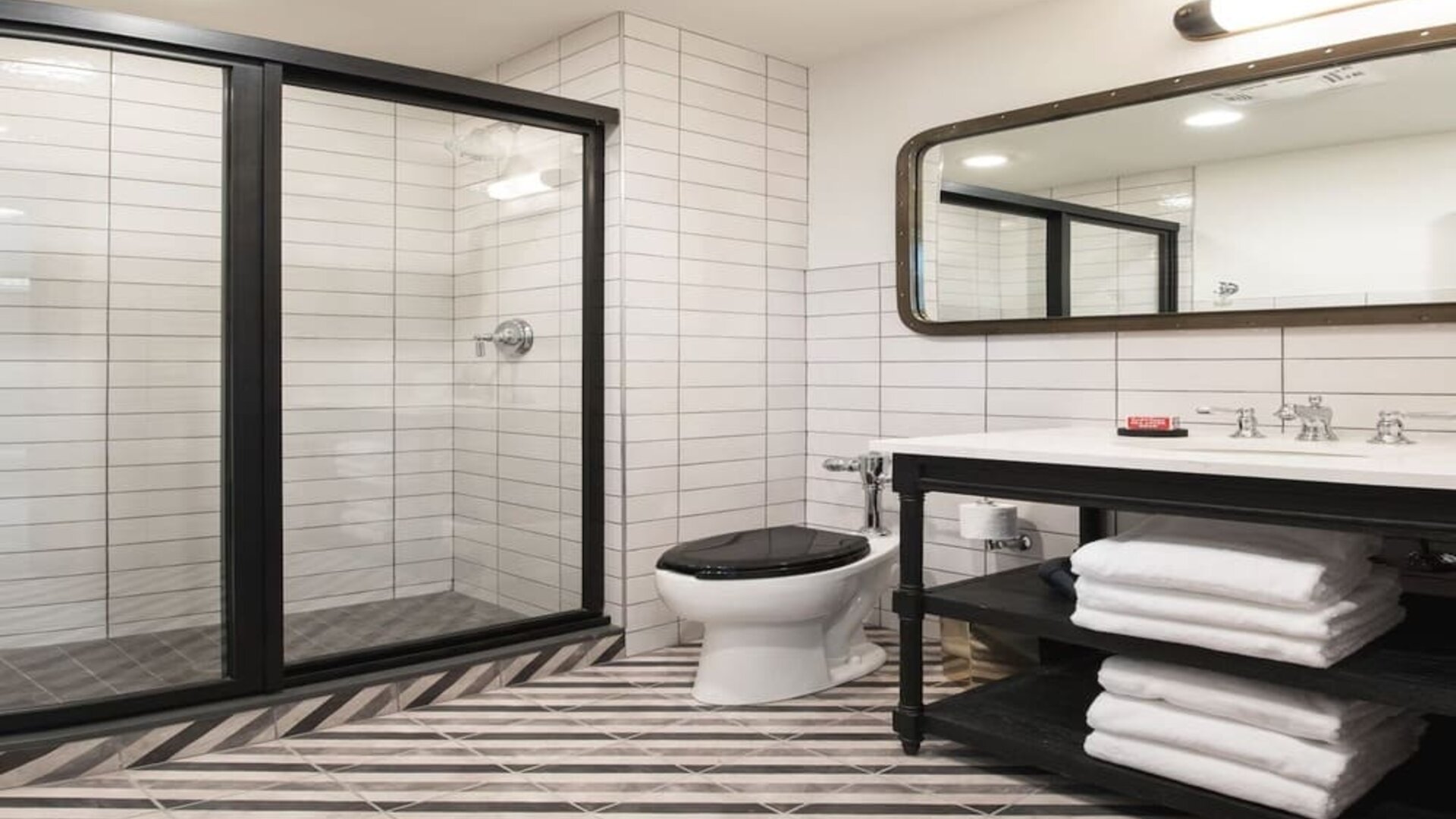 Guest bathroom with shower at The Chicago Hotel Collection River North.